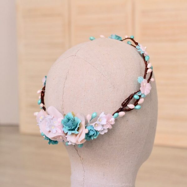 Corona para niña trenzada con flores y pistilos turquesa, blancos y rosa